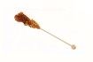 Holzstick mit braunem Kandis.